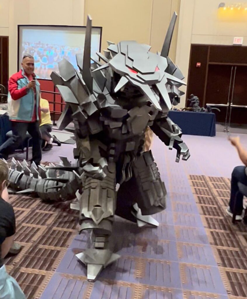 Seth Ortega Anime Mechagodzilla costume walking through the costume parade at G-Fest 2023