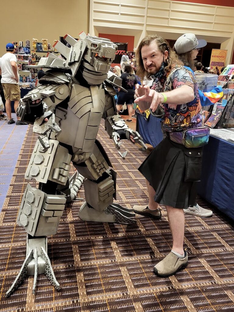 Seth Ortega GvK Mechagodzilla at G-Fest 2022 with kaiju artist Matt Frank