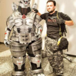 Jonathan Le Guedar standing next to his Mechagodzilla